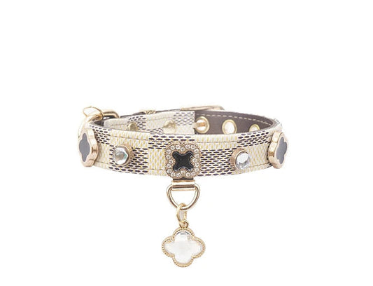 Close-up of adjustable plaid PU leather dog and cat collar showing buckle and strap detail