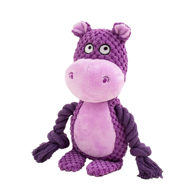 Purple plush hippo dog toy with a rope on a white background