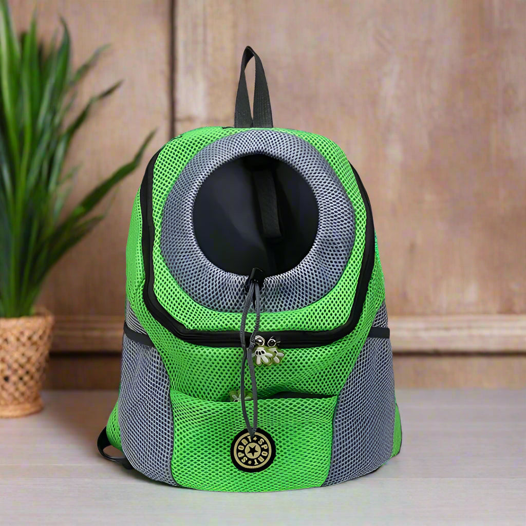 Green and gray pet carrier backpack on a white background