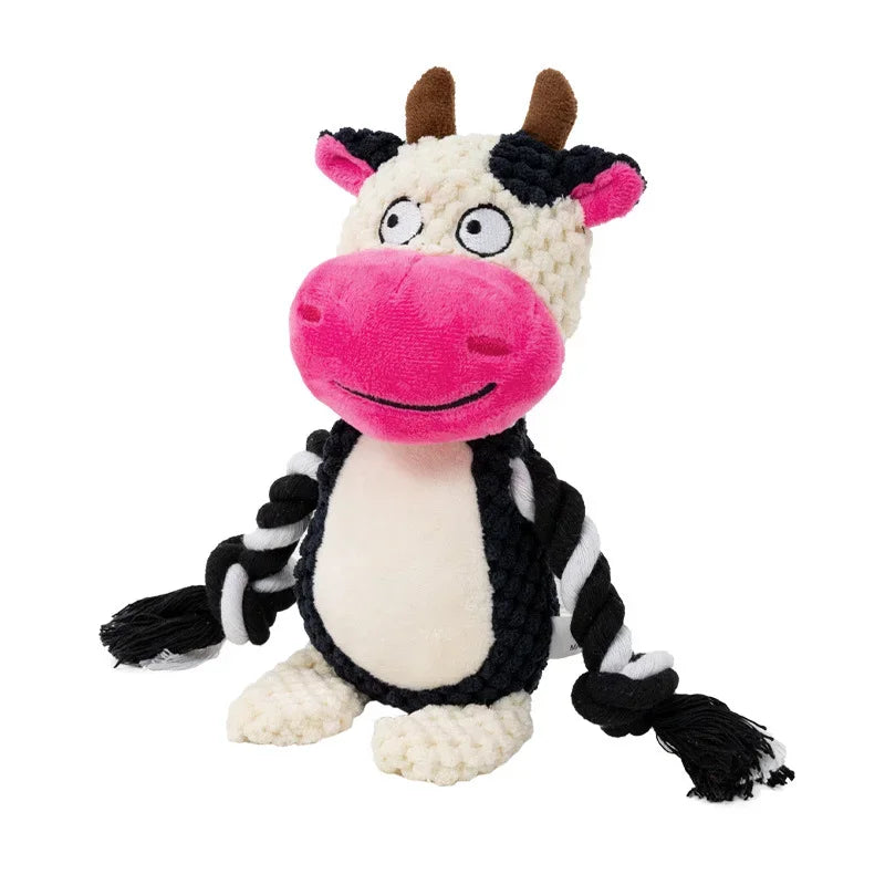 Plush cow toy with a pink nose and black and white pattern on a white background