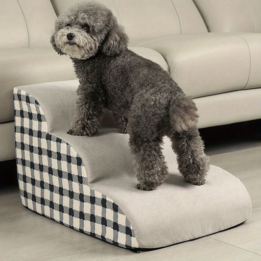 Dog standing on a checkered pet ramp in a living room setting