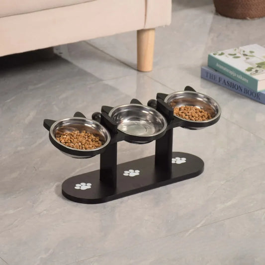 Pet feeding station with three bowls on a gray floor.