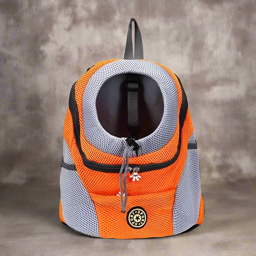 Orange and gray pet carrier backpack on a white background