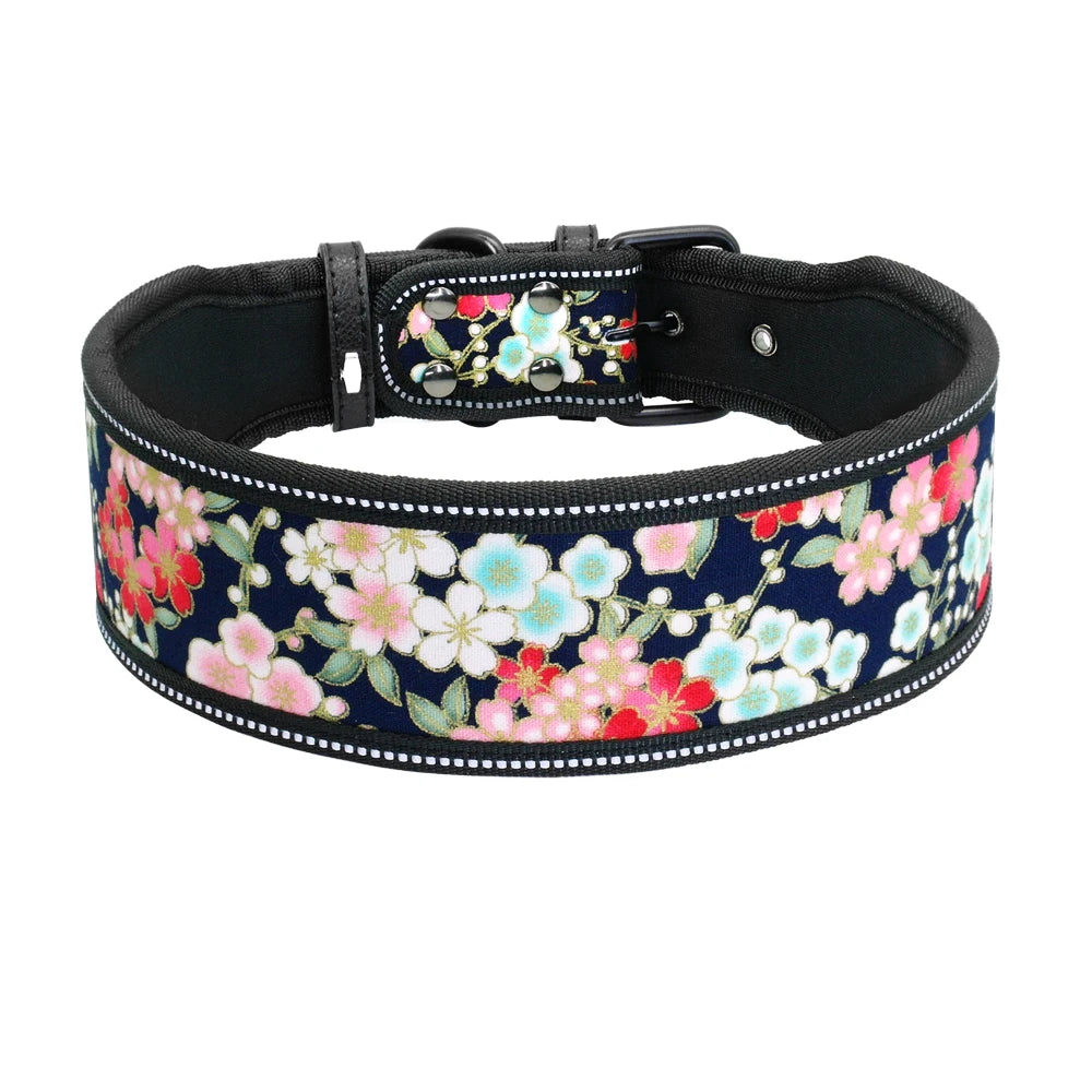 Floral-patterned dog collar with a black strap on a white background
