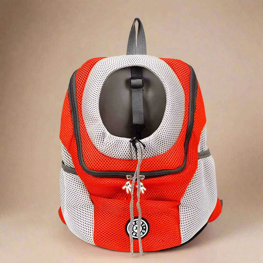 Red and white pet carrier backpack on a white background