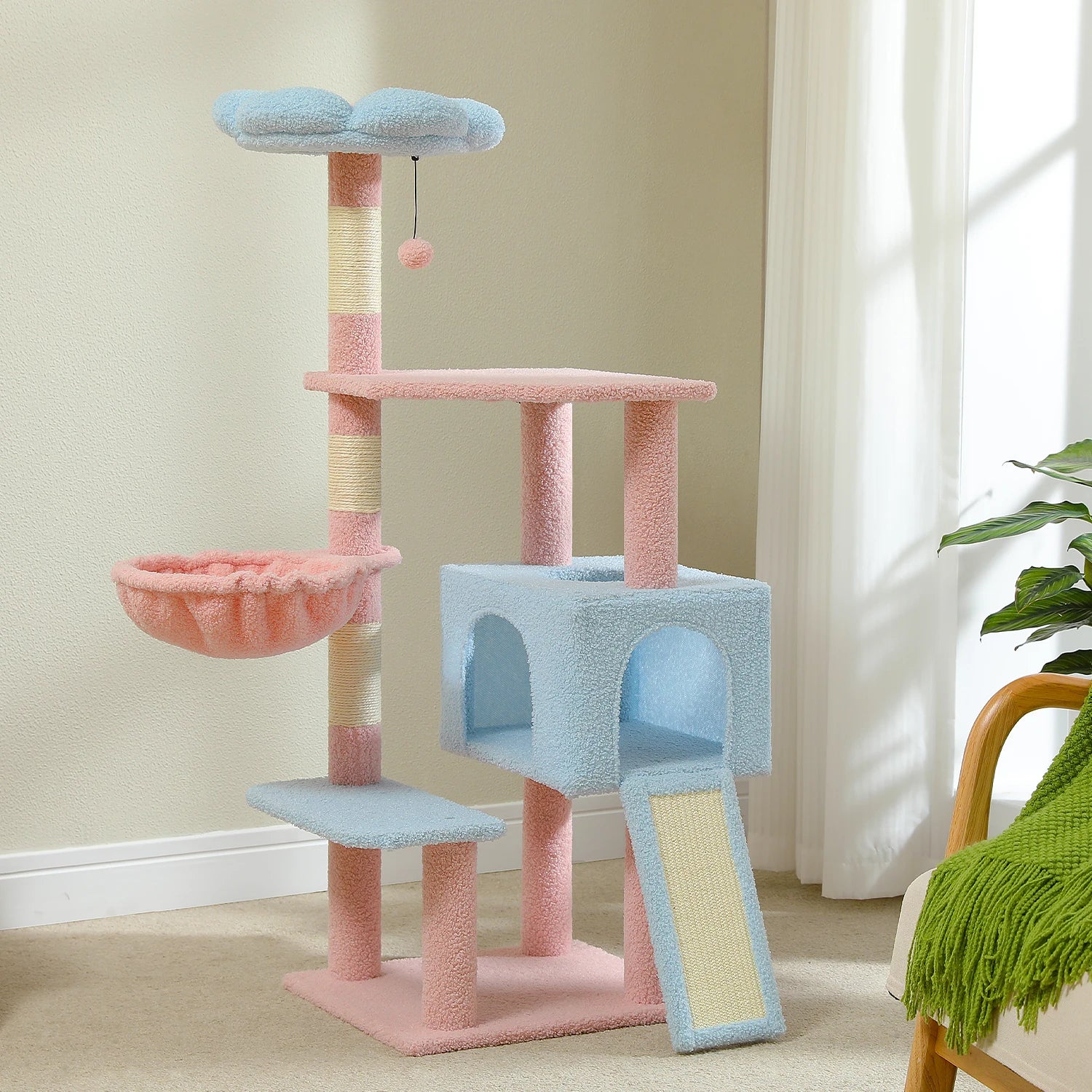 Multicolored cat tree with various platforms and a hanging toy in a room setting.