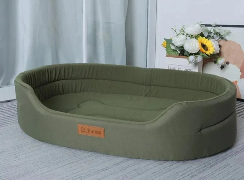 Green pet bed with a brand label on a light background