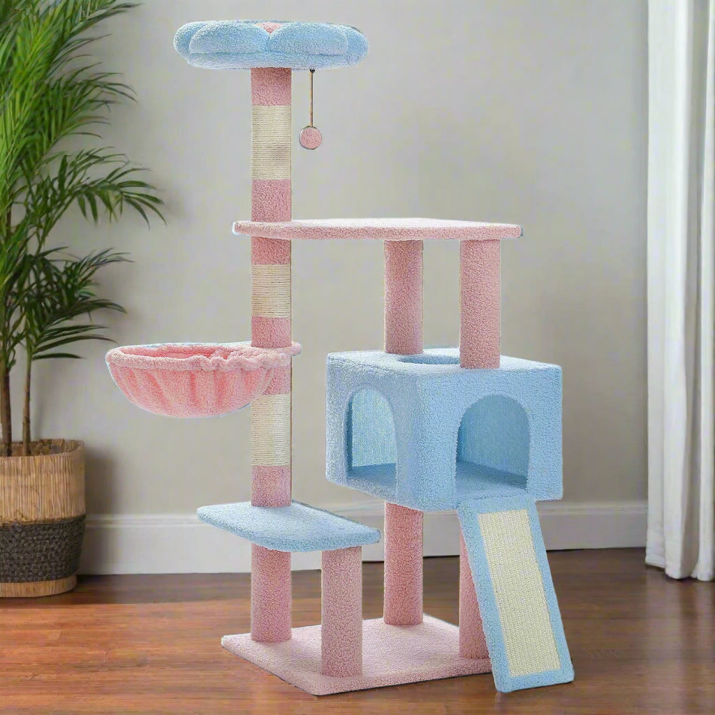 Pink and blue cat tree with multiple levels and a hammock on a white background