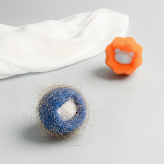A blue PawCatch sponge ball after a wash, with collected pet hair caught in the sponge texture.