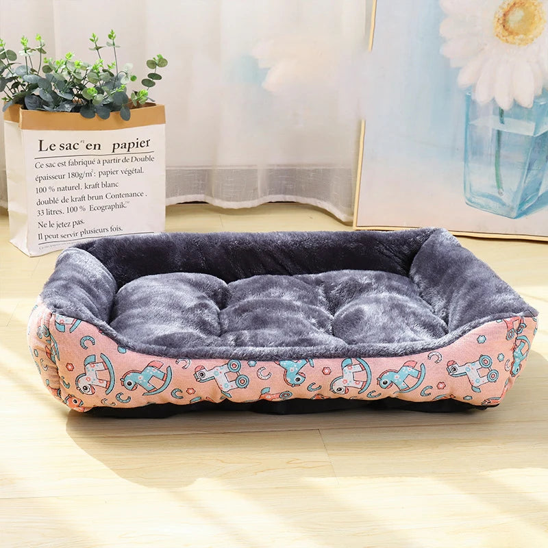 Dog bed with pink and blue pattern on a wooden floor