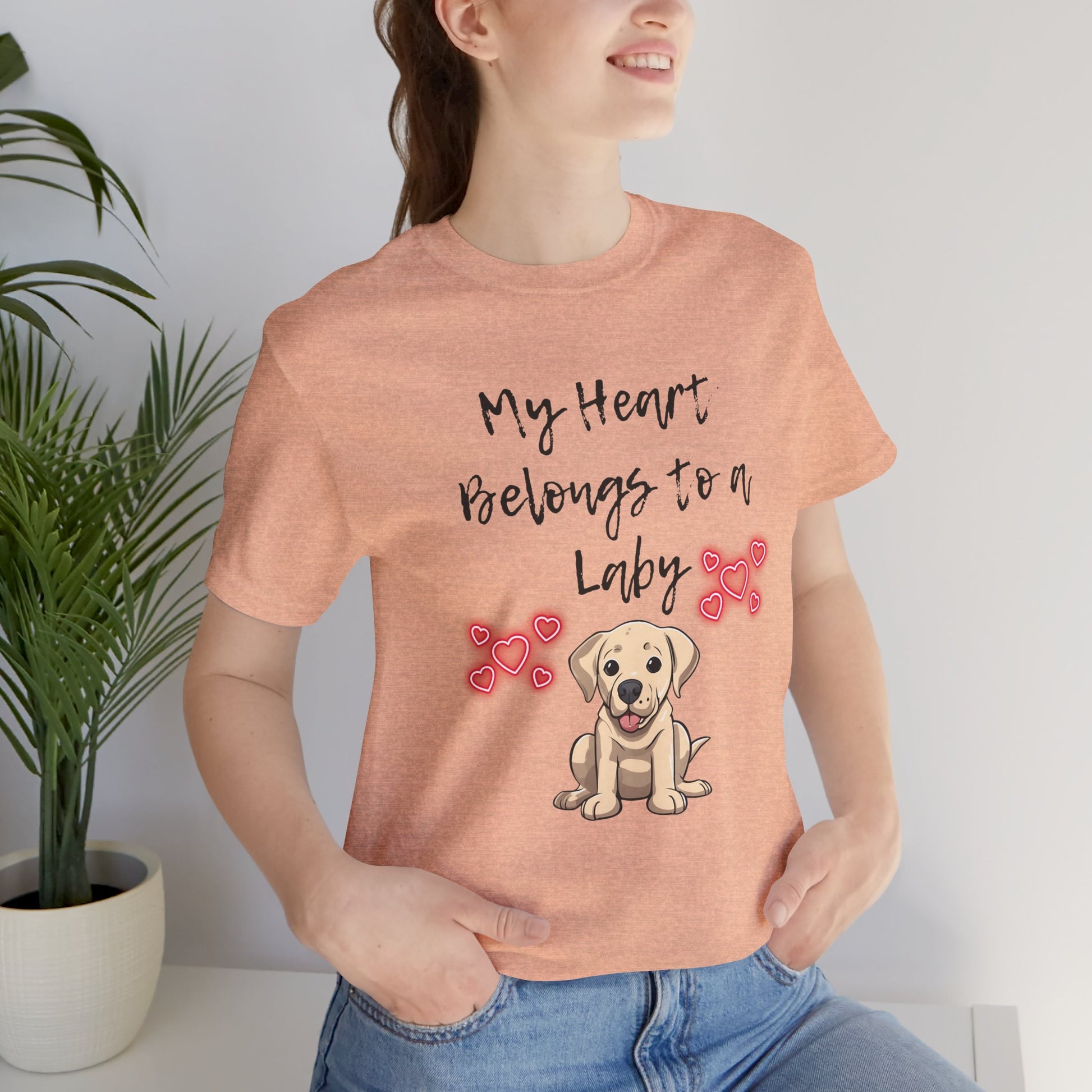 My Heart Belongs to a Laby Labrador t-shirt in Heather Peach worn by a model, front view