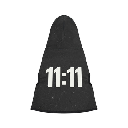 Dog wearing black 11:11 hoodie outdoors