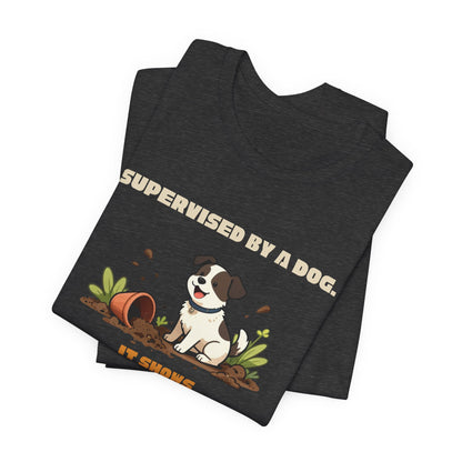 Supervised by a Dog funny gardener tee folded flat