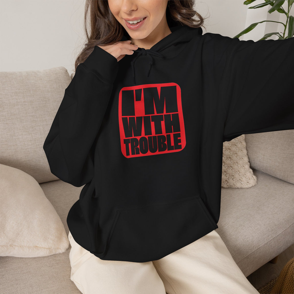 I'm With Trouble Hoodie in Black — bold red graphic on cosy unisex pullover, matches the Trouble Dog Hoodie
