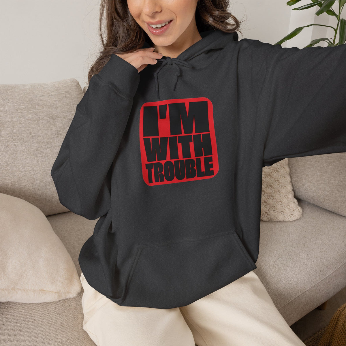 I'm With Trouble Hoodie in Dark Heather — bold red graphic on cosy unisex pullover, matches the Trouble Dog Hoodie