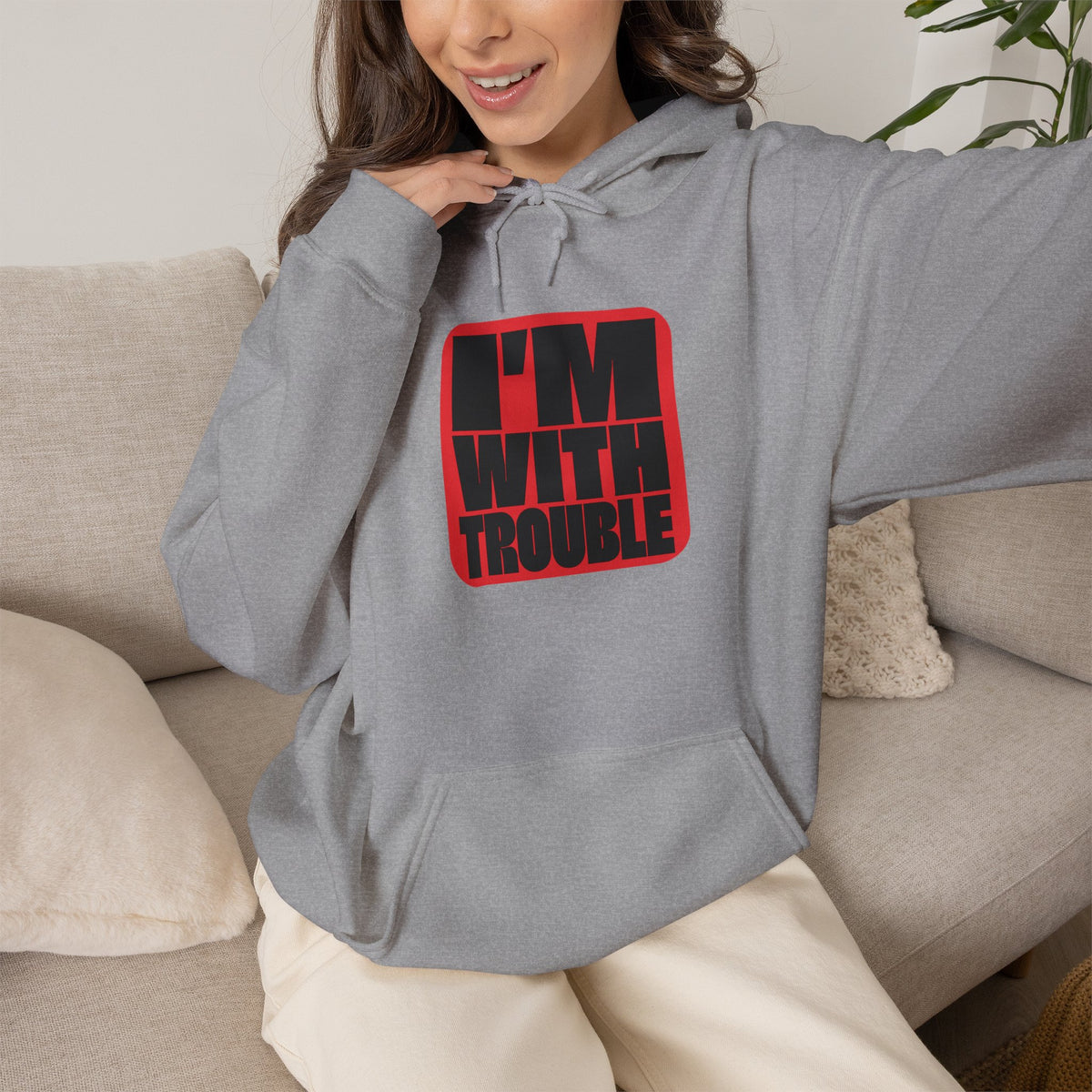 I'm With Trouble Hoodie in Sport Grey — bold red graphic on cosy unisex pullover, matches the Trouble Dog Hoodie