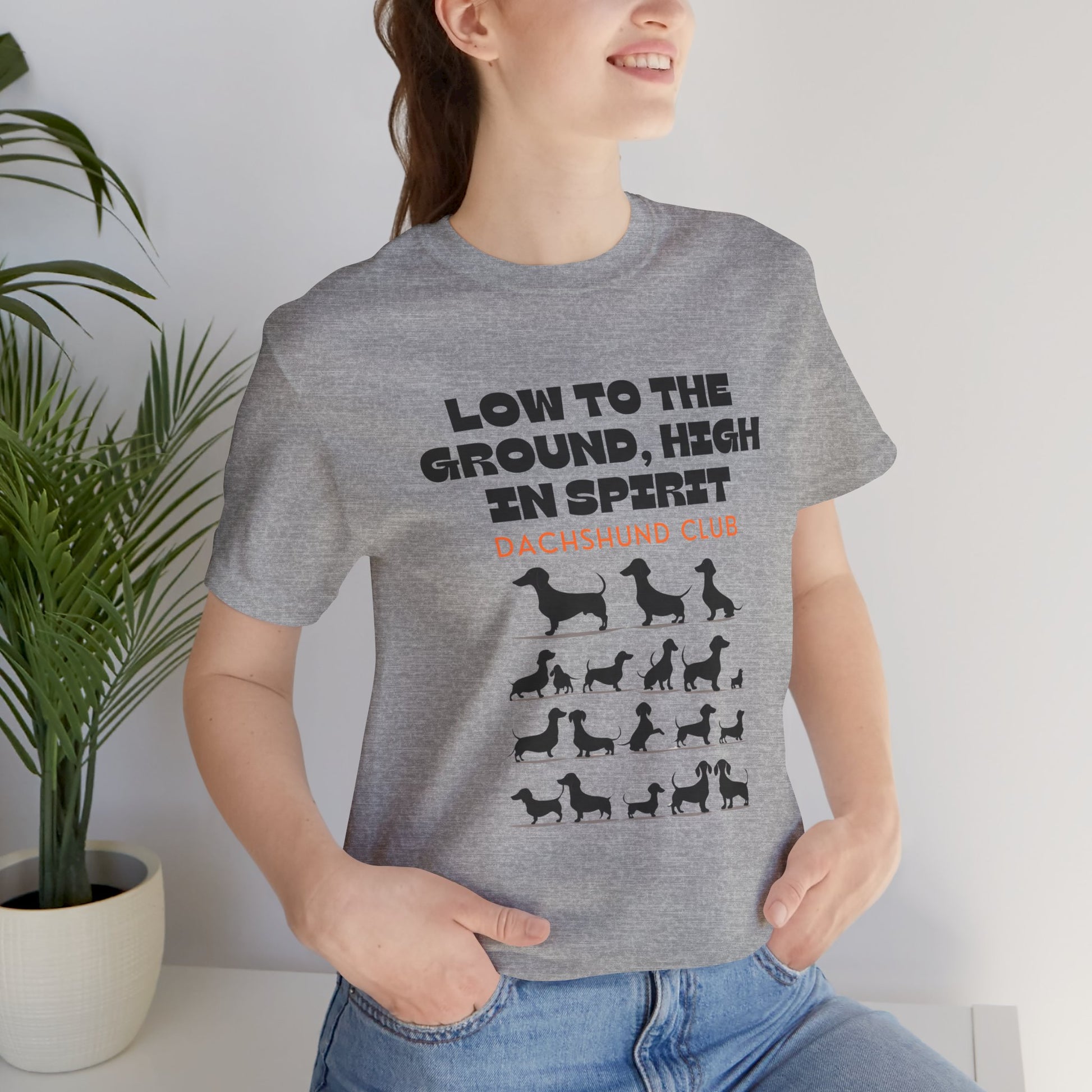 Woman wearing Athletic Heather Dachshund Club t-shirt with dachshund silhouettes design