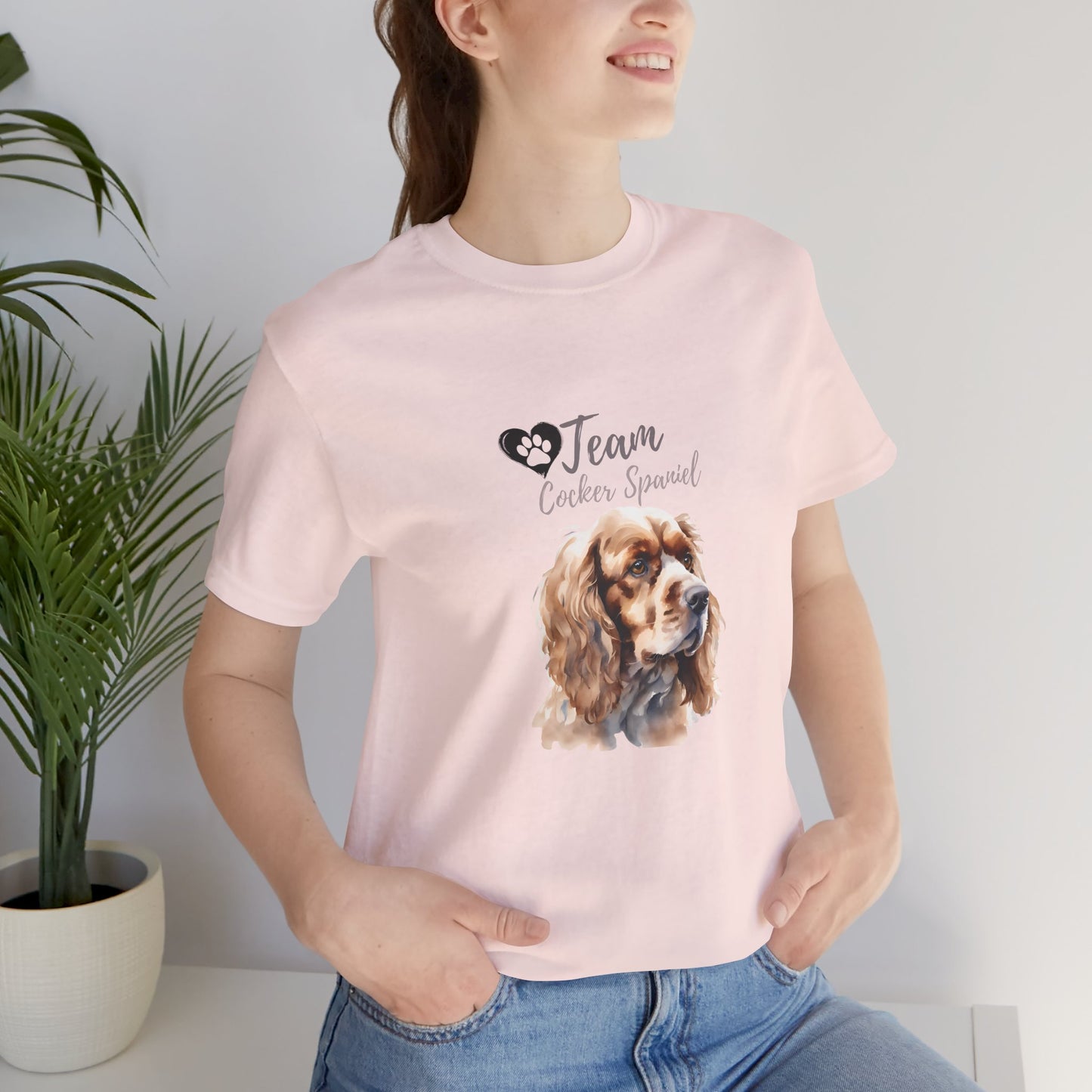 Team Cocker Spaniel watercolour t-shirt in Soft Pink worn by a model, front view