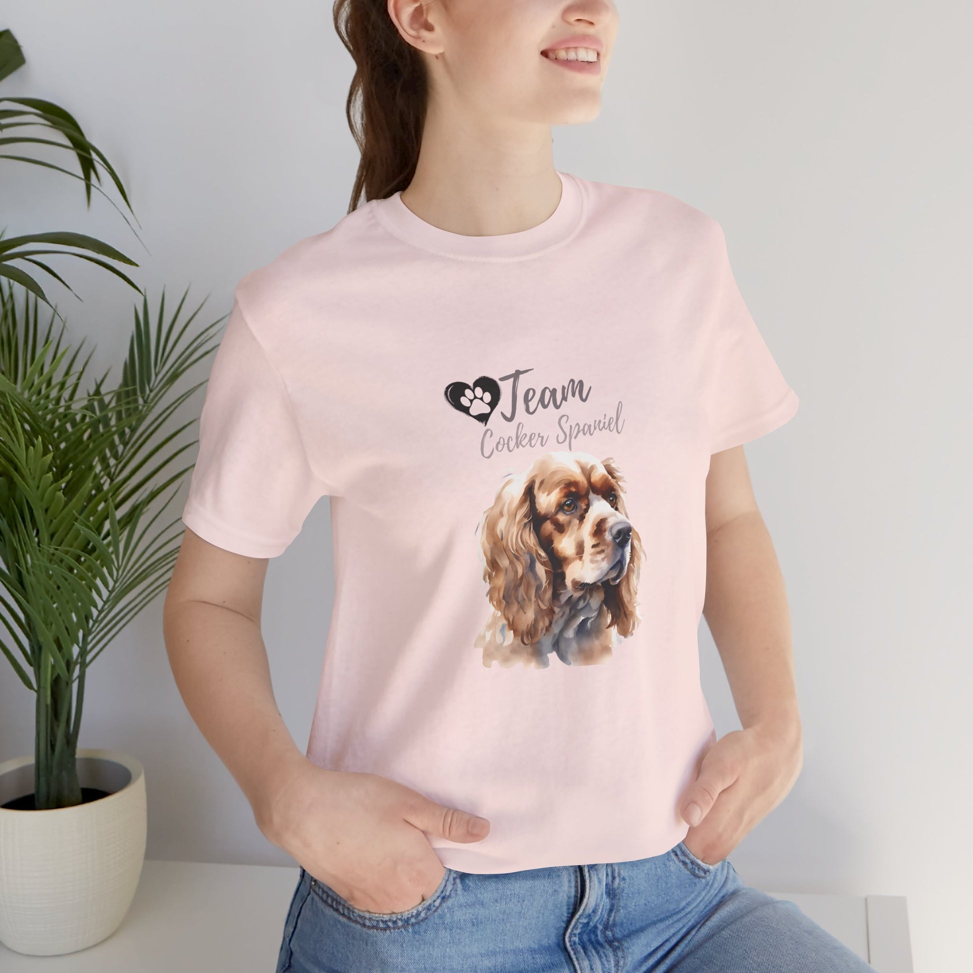 Team Cocker Spaniel watercolour t-shirt in Soft Pink worn by a model, front view