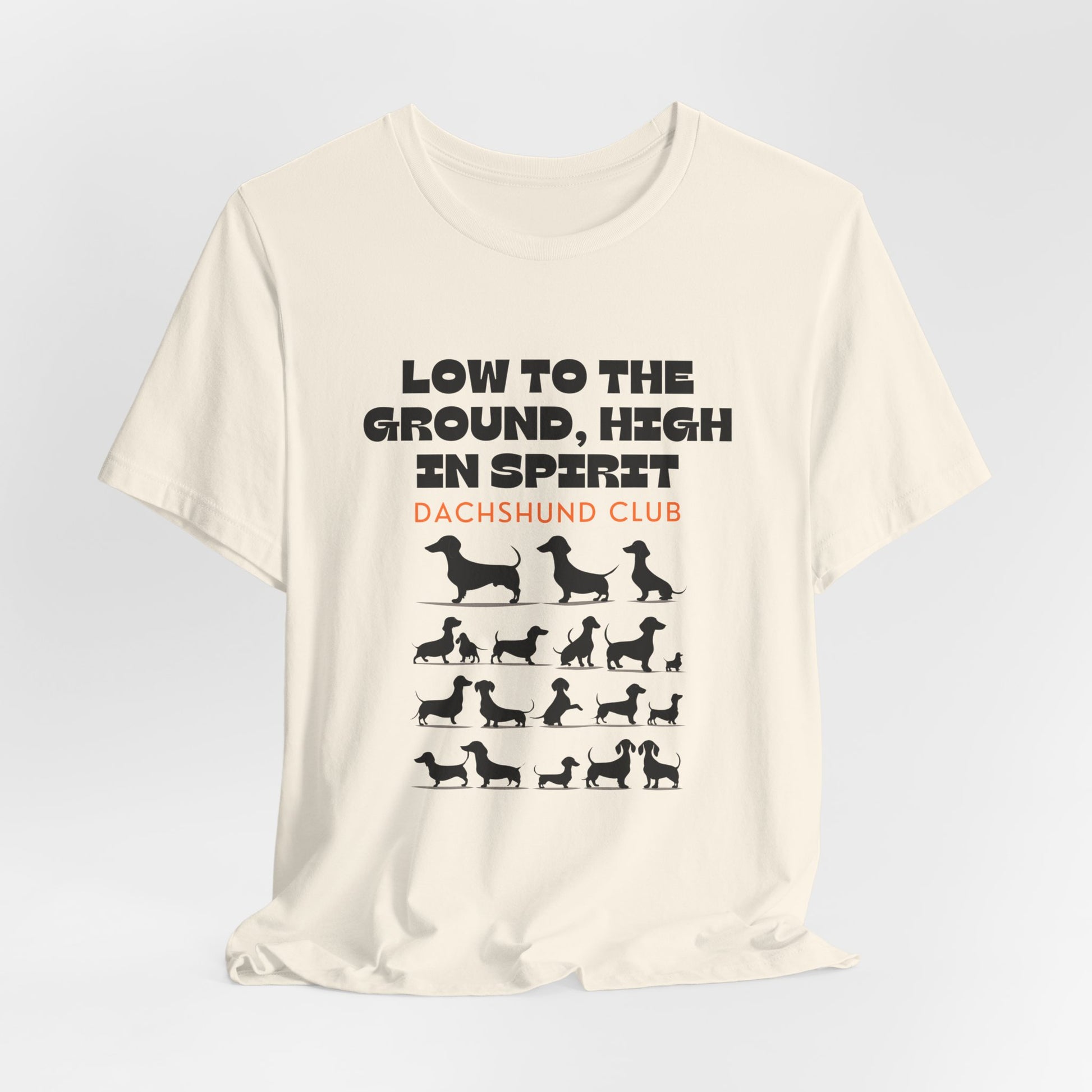 Natural Dachshund Club graphic tee laid flat showing Low to the Ground High in Spirit print