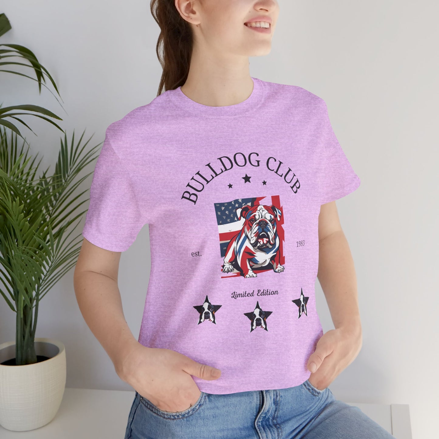 Woman wearing Heather Prism Lilac Bulldog Club t-shirt with flag bulldog design