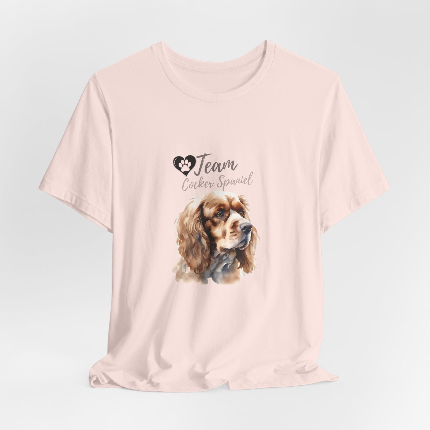 Team Cocker Spaniel watercolour t-shirt in Soft Pink, hanging front view
