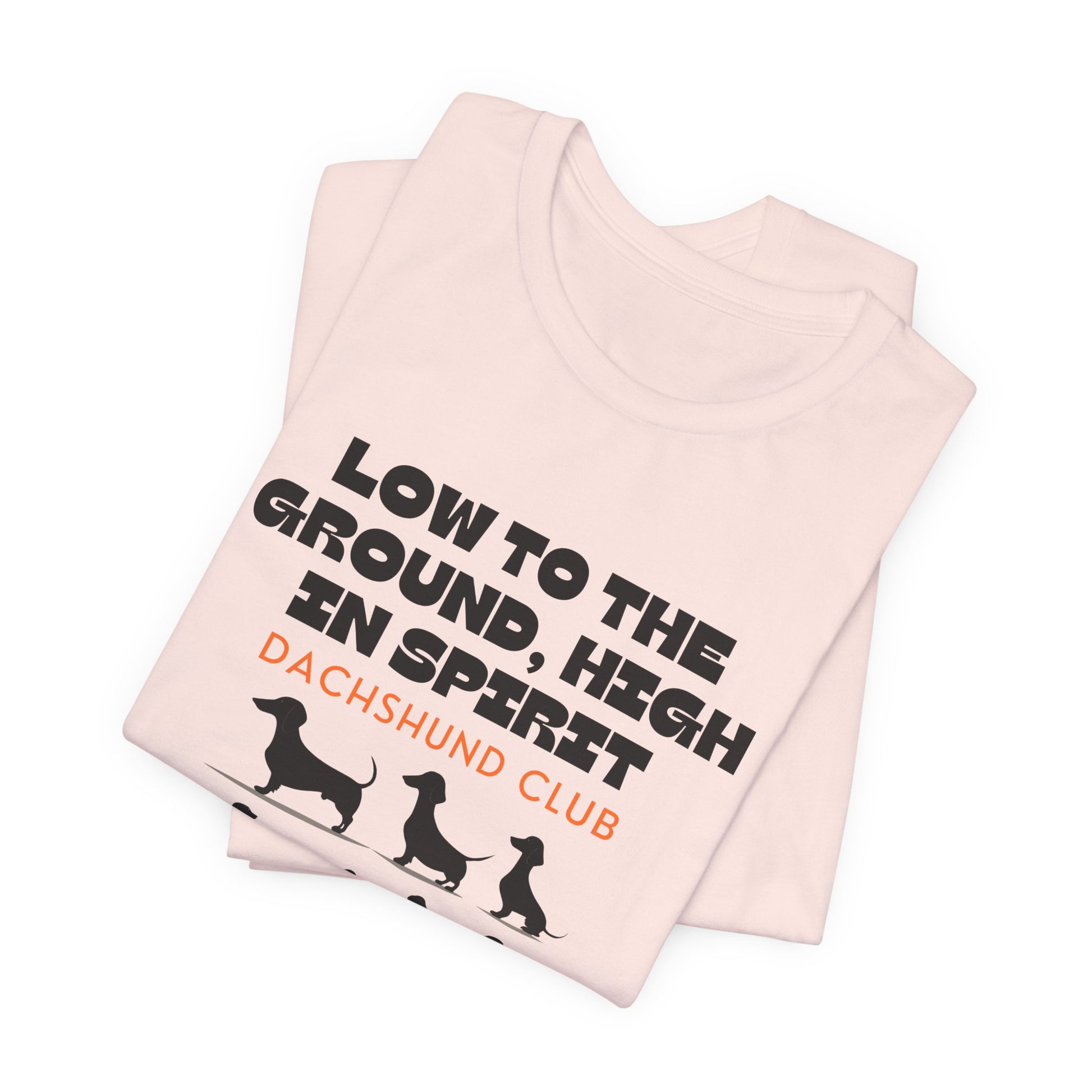 Folded Soft Pink Dachshund Club t-shirt with dachshund silhouettes design