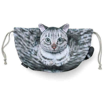A cat-shaped makeup bag with a 3D print of a cat's head and tail, featuring a black and white color scheme. The bag has a drawstring closure and a portable design.