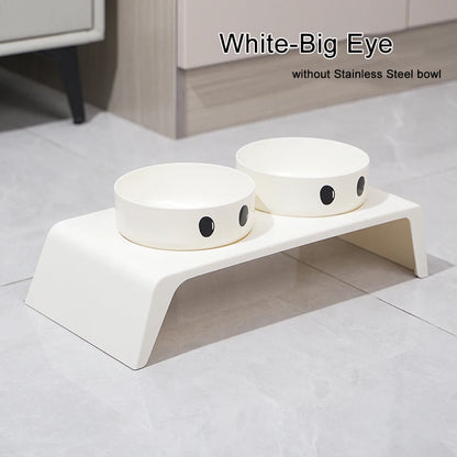 White elevated pet feeder with two bowls on a light gray floor.