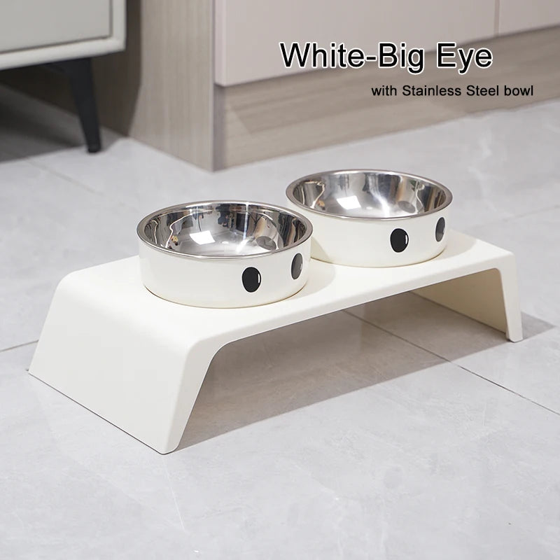 White pet feeding station with two stainless steel bowls on a light gray floor.