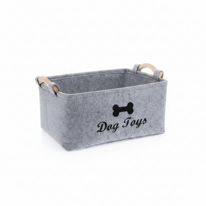 Grey felt dog toy storage box with wooden carry handles and black bone graphic on the front panel