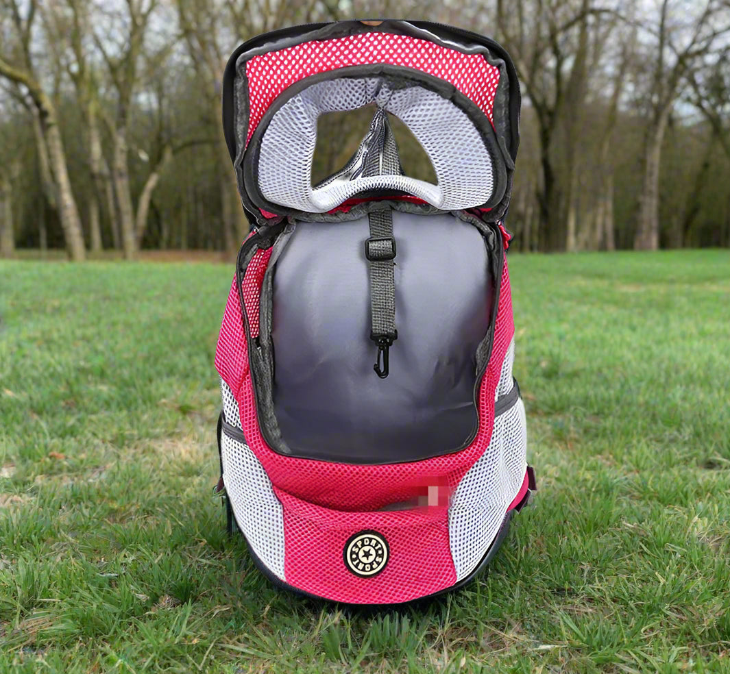 PawVoyage™ front-facing pet carrier backpack in pink and gray on white background