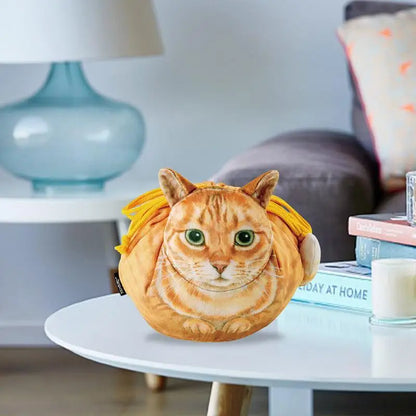 Ginger tabby plush cat face drawstring pouch sitting on a white side table in a living room