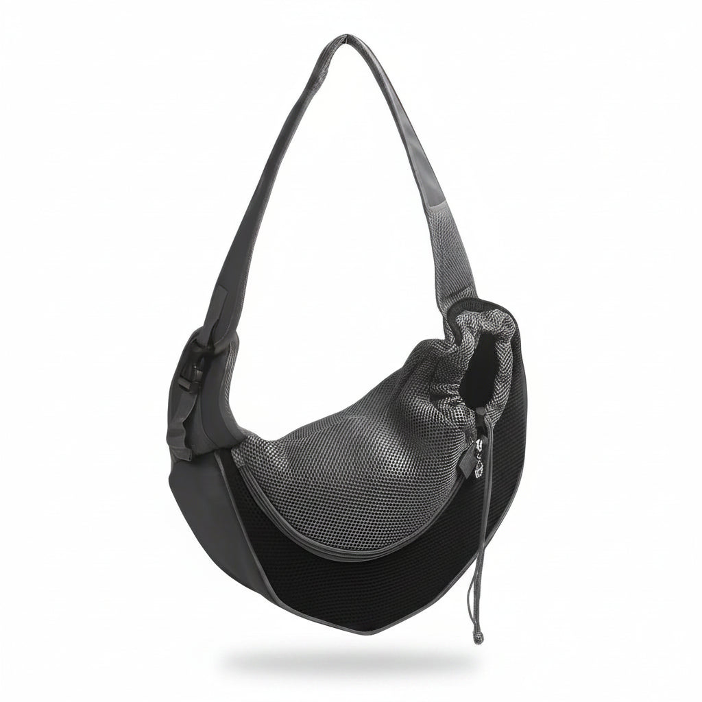 Hands-free pet sling carrier in black with breathable mesh side panel, padded adjustable shoulder strap, and drawstring opening for cats and small dogs.