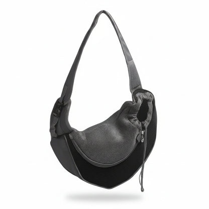 Hands-free pet sling carrier in black with breathable mesh side panel, padded adjustable shoulder strap, and drawstring opening for cats and small dogs.