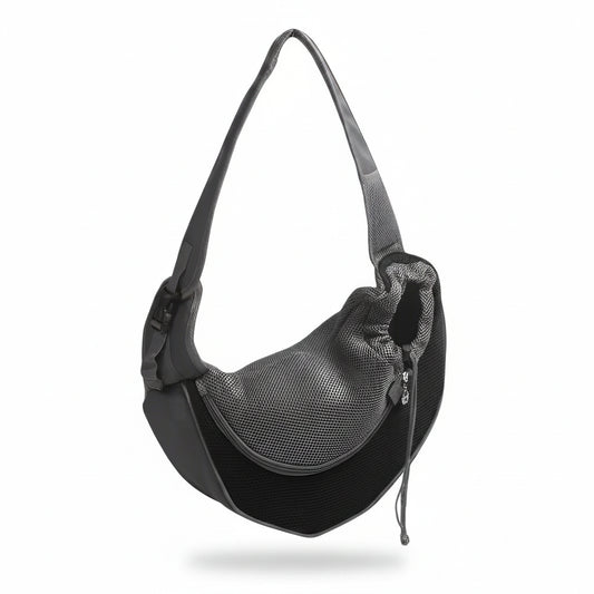 Hands-free pet sling carrier in black with breathable mesh side panel, padded adjustable shoulder strap, and drawstring opening for cats and small dogs.