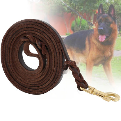 Braided leather dog lead in Heritage Brown held by owner walking a German Shepherd — IronPaw Heritage by SniffWaggleNWalk.