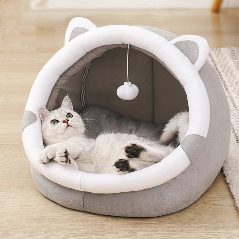 PawDome cat cave bed showing cat inside — cosy enclosed sleeping space with room to peek out