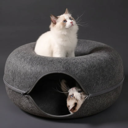 Dark grey PawDen felt cat cave in enclosed mode with cat resting inside the donut tunnel