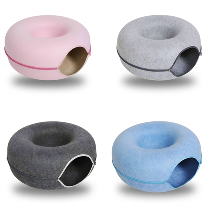Four PawDen felt cat caves in dark grey, light grey, blue, and pink shown as flat lay comparison