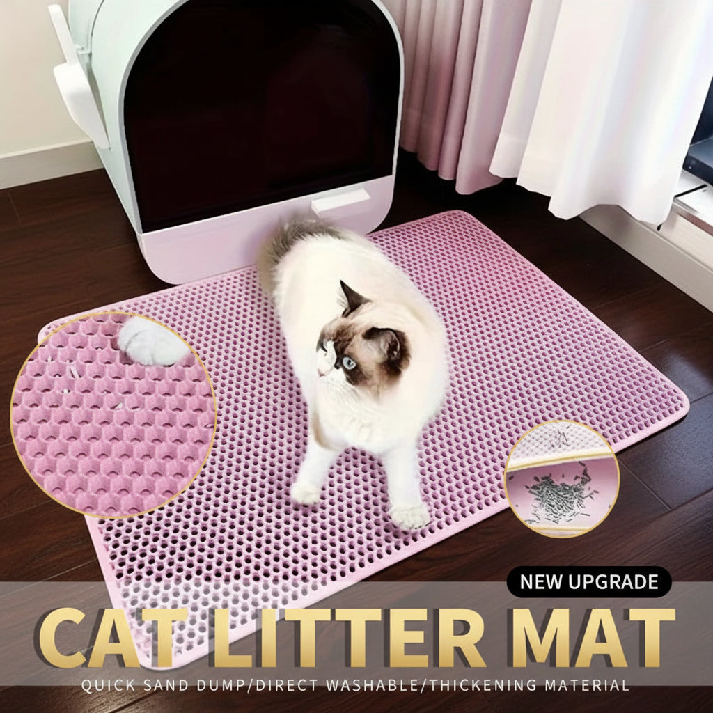 Pink PawMat™ double-layer honeycomb cat litter mat on a light floor with a cat standing on it beside a litter box