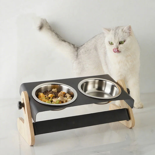 Adjustable tilt elevated pet bowl stand with two stainless steel bowls, black steel frame and beech wood side panels