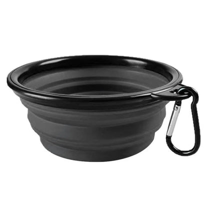 Black PawTrek foldable silicone dog travel bowl with integrated carabiner clip