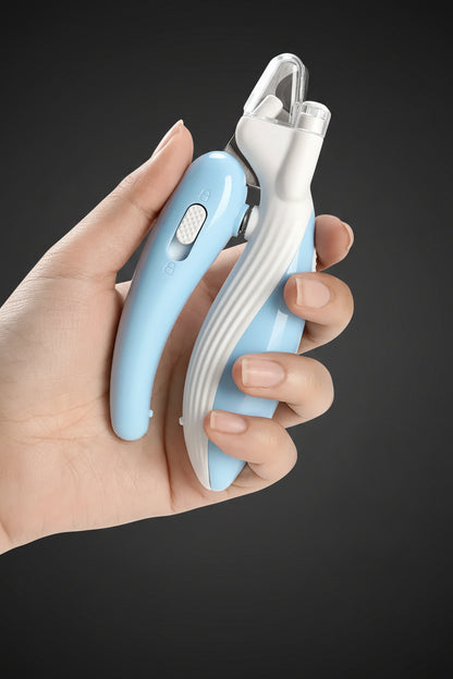 Hand holding a blue and white pet nail clipper against a white background