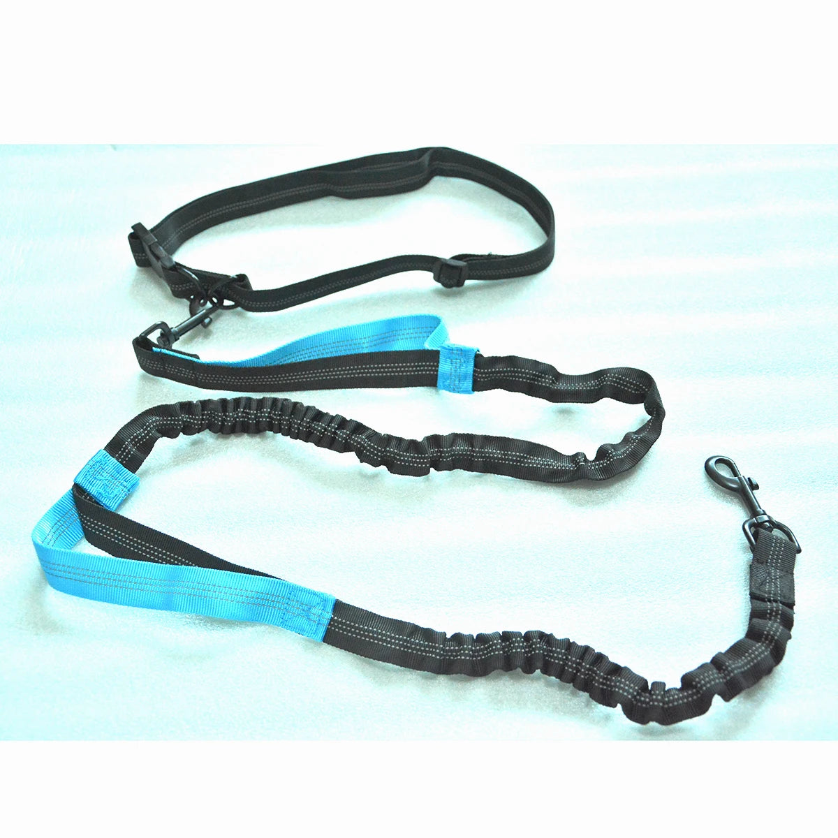 FreePace™ hands-free bungee dog lead in black — waist belt, dual emergency handles and reflective threading detail
