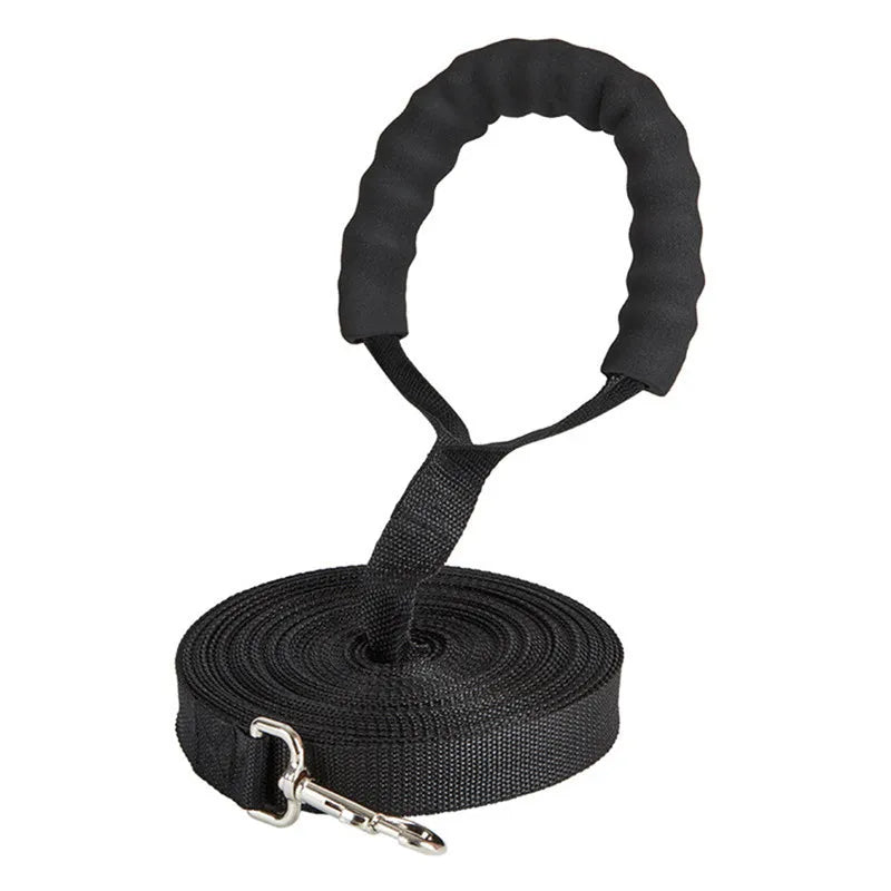 LongLine™ 10m training lead held in hand — padded sponge handle comfortable for long recall training sessions