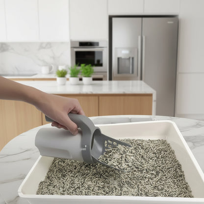 PawSift sifting cat litter scoop separating clean clumping clay litter from waste in slotted scoop head