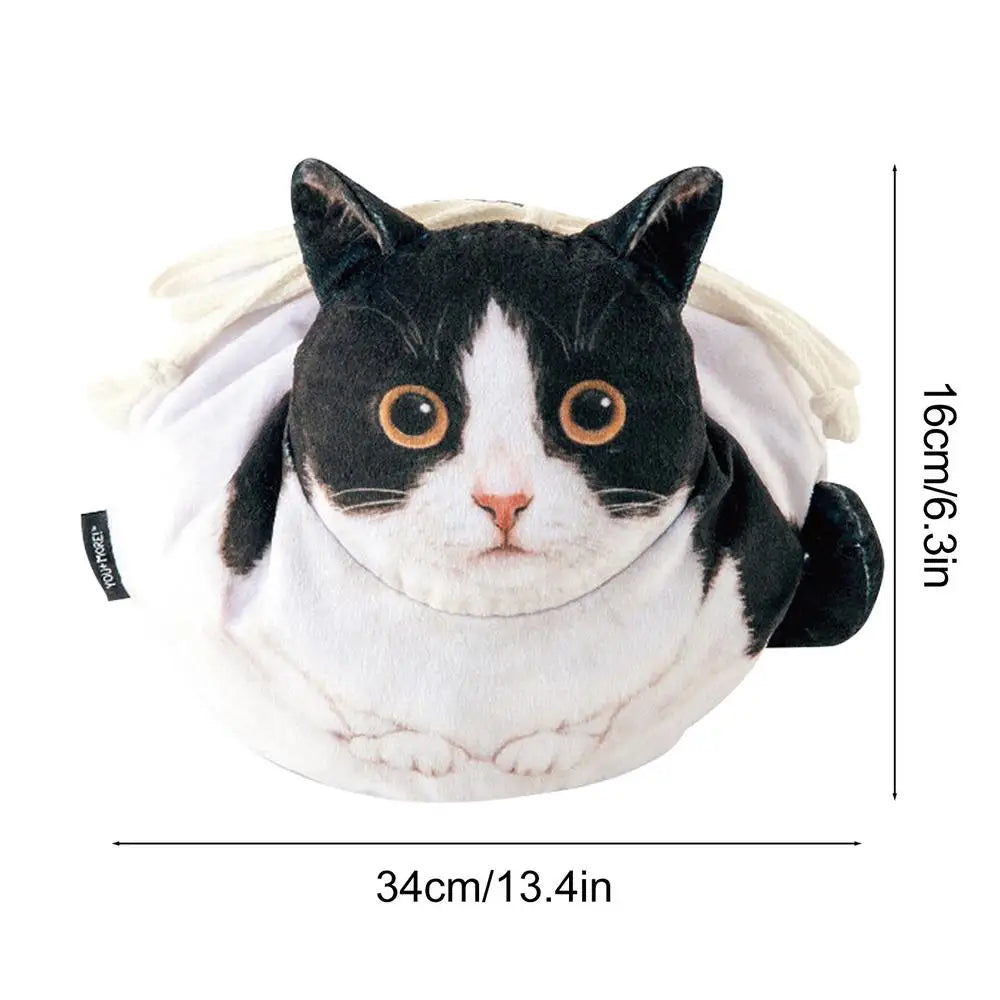 Close-up of tuxedo black and white cat face plush drawstring pouch showing 3D sculpted face detail 