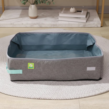 The waterproof oxford cloth lining of a PawPort travel cat litter box holding a pool of water without leaking