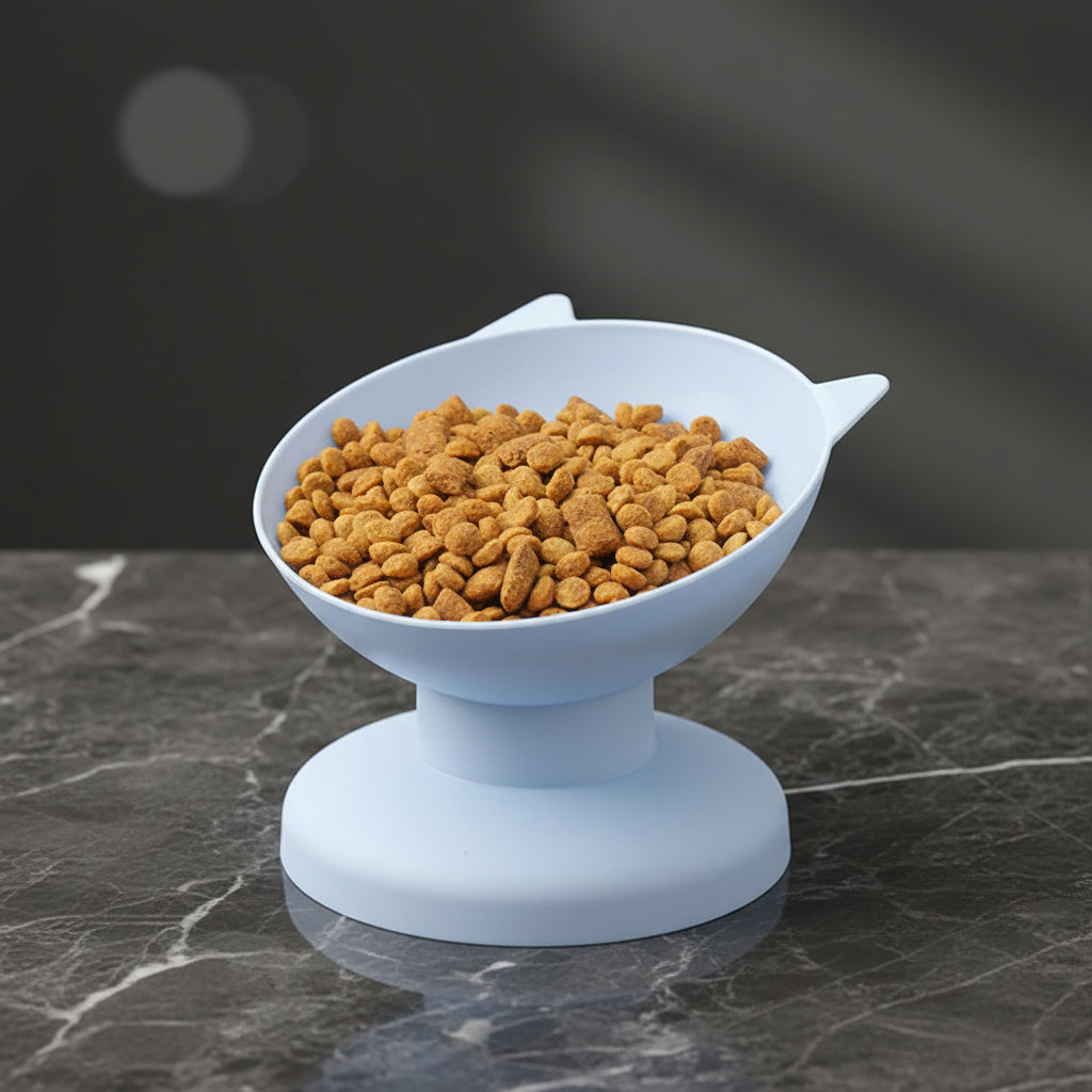 Elevated white pet bowl filled with cat food, placed on a wooden surface with a red and white checkered cloth in the background.